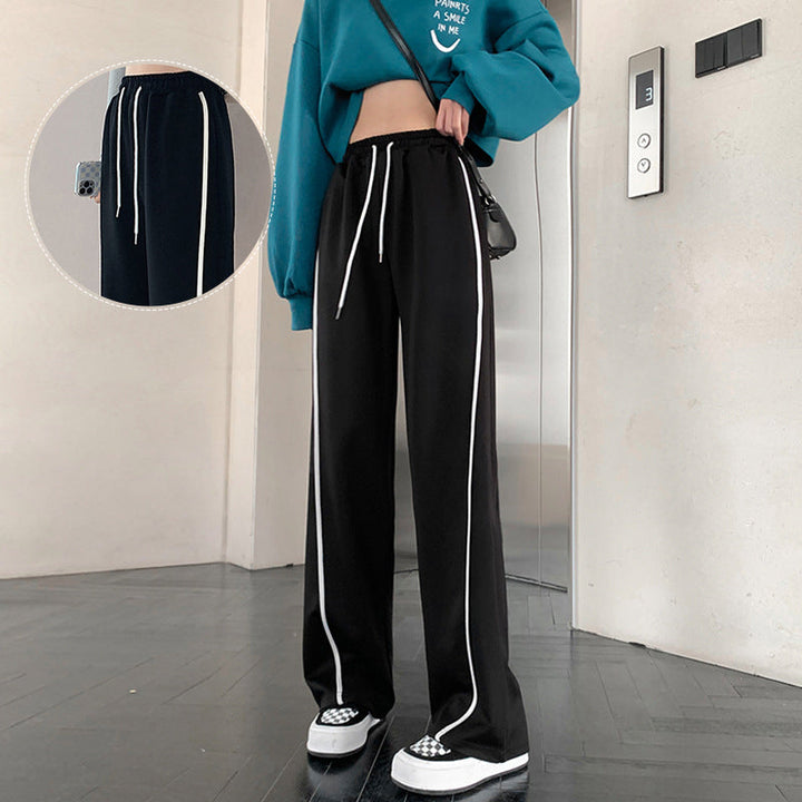 "Dam vida höga midjebyxor med randigt mönster i polyester, kontor och casual stil, framifrån visning."