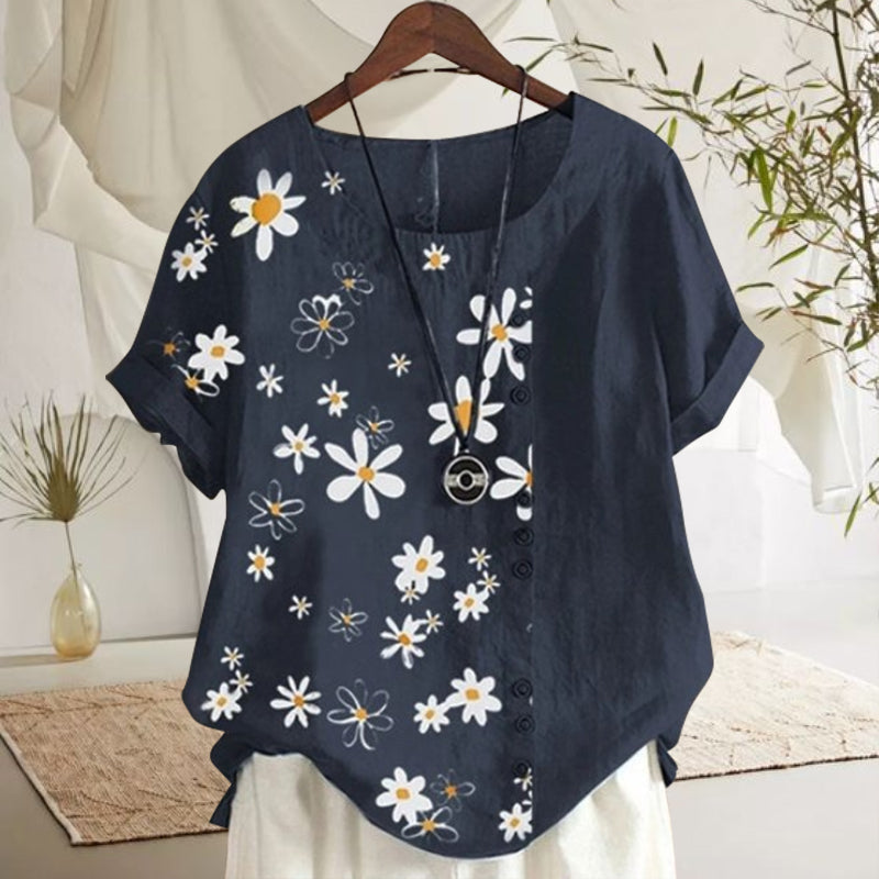 "Damblus med prästkrage och blommönster, rund hals, korta ärmar i mjuk bomull, elegant och avslappnad stil."