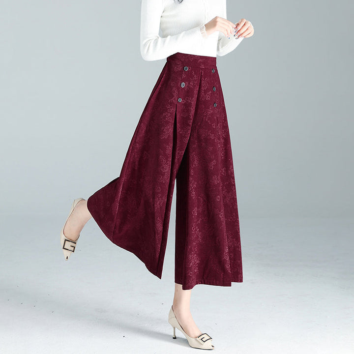 "Dambyxor i polyester, hög midja, vida ben. Stilren design för modern look. Perfekt för både arbete och fritid."