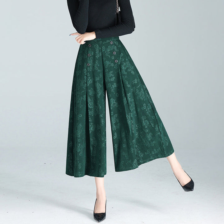 "Dambyxor i polyester, hög midja, vida ben. Stilren design för modern look. Perfekt för både arbete och fritid."