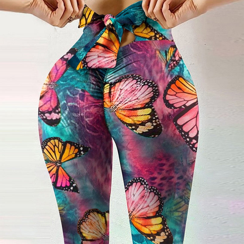 Dambyxor i polyester med tryckt mönster, formande passform och andningsbart material, perfekt för yoga och vardag.