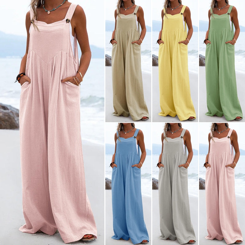 "Damer enfärgad overall med breda ben i polyester, elastisk och stilren design i flera färger, ideal för olika tillfällen."