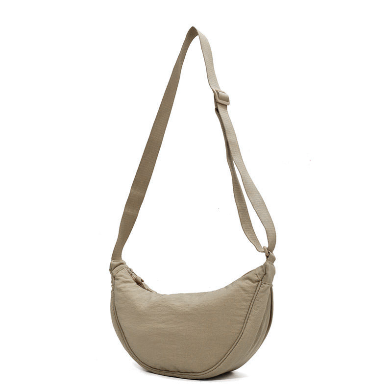 "Damer halvmåne crossbody-väska av slitstarkt nylon i gul färg med justerbar axelrem, stilren och praktisk."
