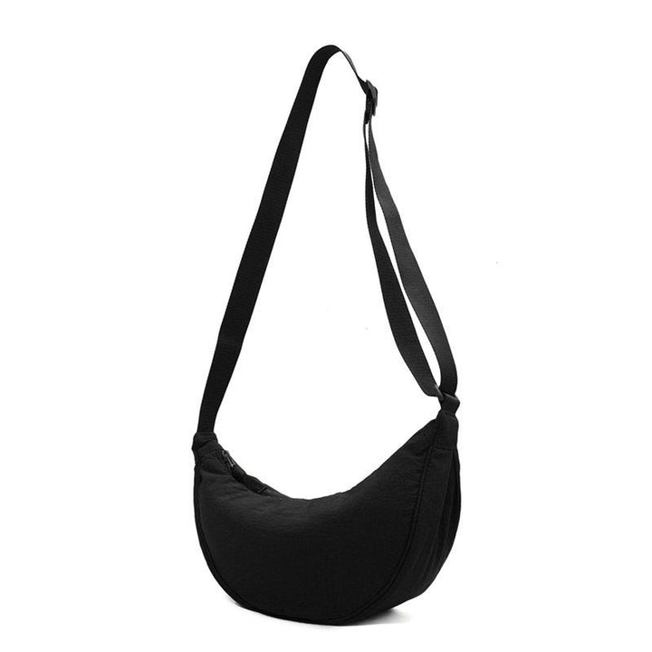 "Damer halvmåne crossbody-väska av slitstarkt nylon i gul färg med justerbar axelrem, stilren och praktisk."
