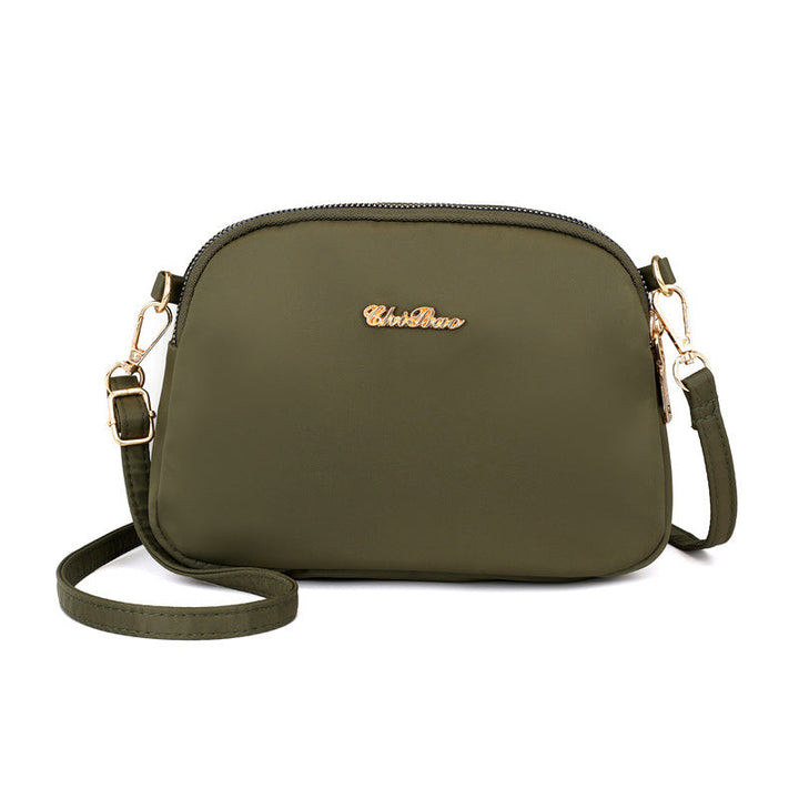 "Damer nylon crossbody kurirväska, vattenavvisande, justerbar axelrem, elegant design i flera färger, slitstark."
