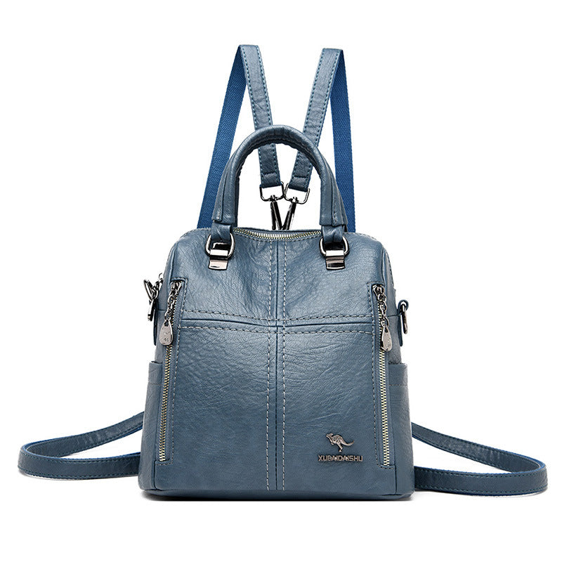 "Damer PU-läder multifunktionell ryggsäck i röd, elegant och slitstark design för vardag och resor, stor kapacitet."