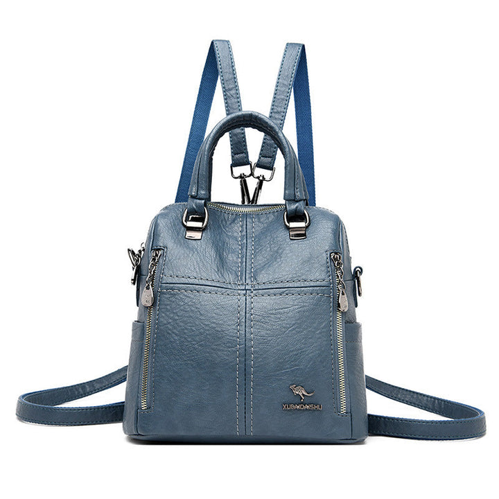 "Damer PU-läder multifunktionell ryggsäck i röd, elegant och slitstark design för vardag och resor, stor kapacitet."