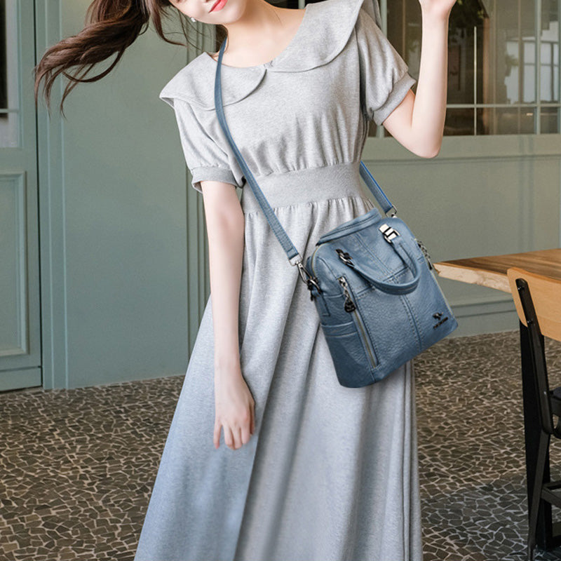 "Damer PU-läder multifunktionell ryggsäck i röd, elegant och slitstark design för vardag och resor, stor kapacitet."