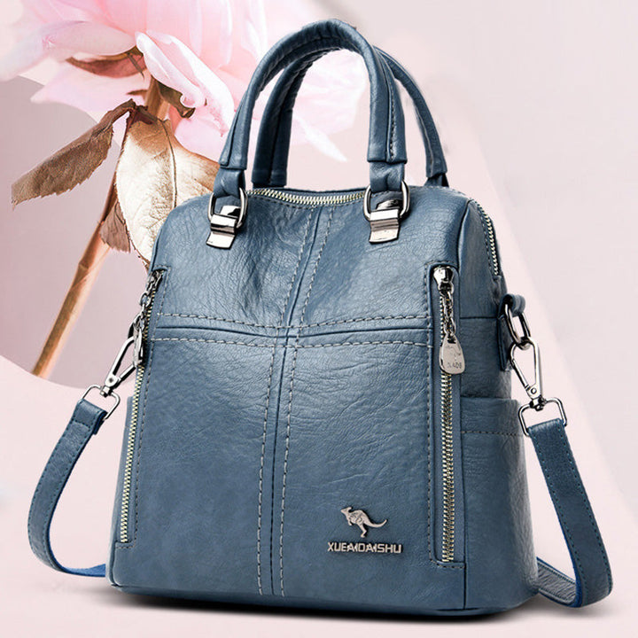 "Damer PU-läder multifunktionell ryggsäck i röd, elegant och slitstark design för vardag och resor, stor kapacitet."