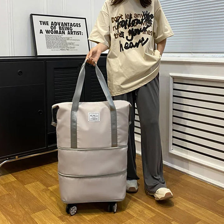 "Damer resväska i Oxford-tyg med stor kapacitet, elegant design och fyrhjulsdesign för enkel rörlighet."