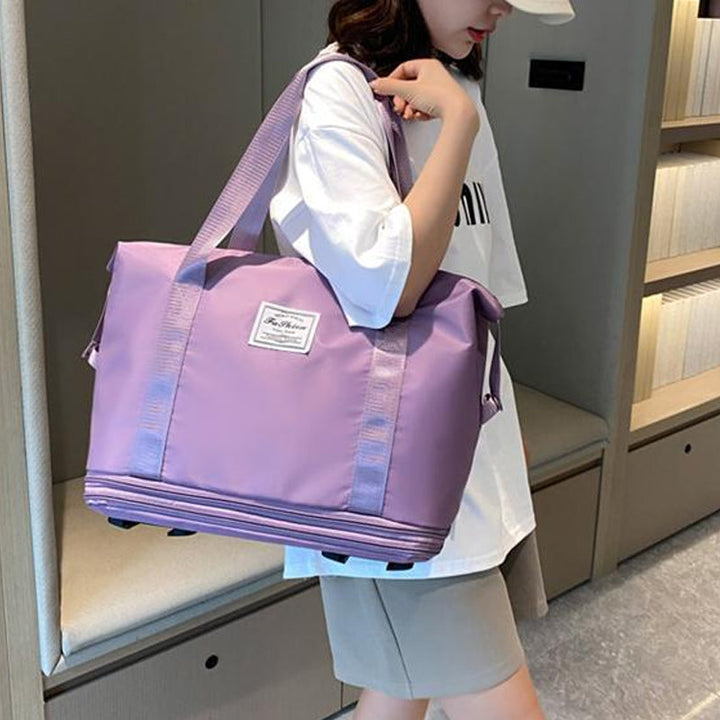 "Damer resväska i Oxford-tyg med stor kapacitet, elegant design och fyrhjulsdesign för enkel rörlighet."