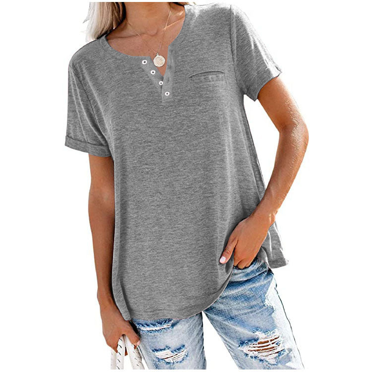 "Damer V-ringad T-shirt i bomull med fickdetalj, elegant design, visar fickan och V-ringningen, finns i flera färger."