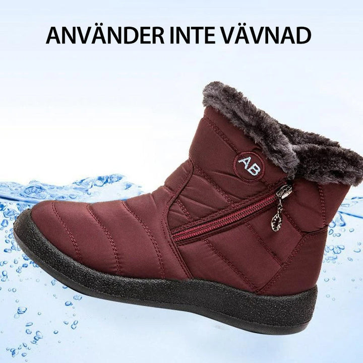 "Damer Vattentäta Snöskor i svart med värmande fluff, tålig gummisula och elegant design för vintern."