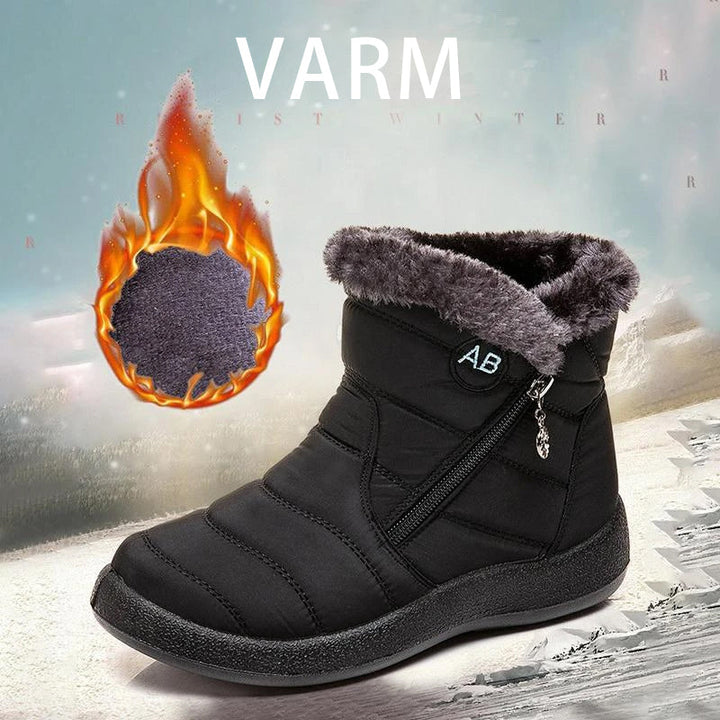 "Damer Vattentäta Snöskor i svart med värmande fluff, tålig gummisula och elegant design för vintern."