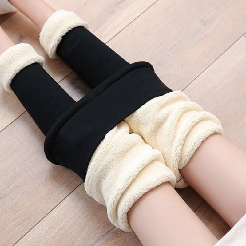 "Damer vinter leggings med plysch foder i svart, hög midja, varm och bekväm design för kallt väder, flexibelt material."