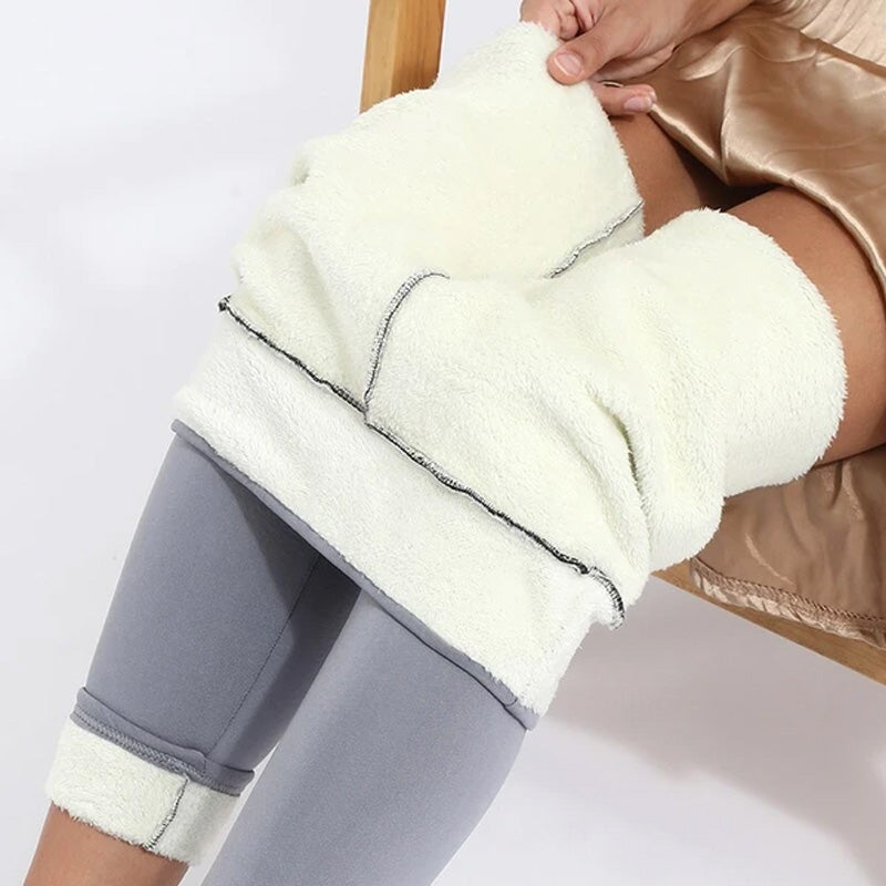 "Damer vinter leggings med plysch foder i svart, hög midja, varm och bekväm design för kallt väder, flexibelt material."