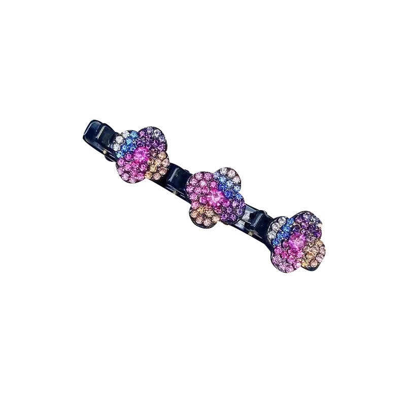 "Damhårklämma med tre strassblommor, glittrande, elegant accessoar för kvinnor, perfekt för glamorös stil."
