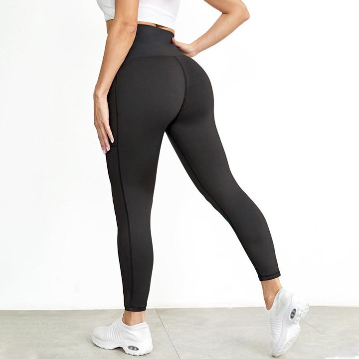 "Damhög midja leggings, elastisk passform, svart, formande, sidfickor, för träning och vardag. Perfekt för komfort."