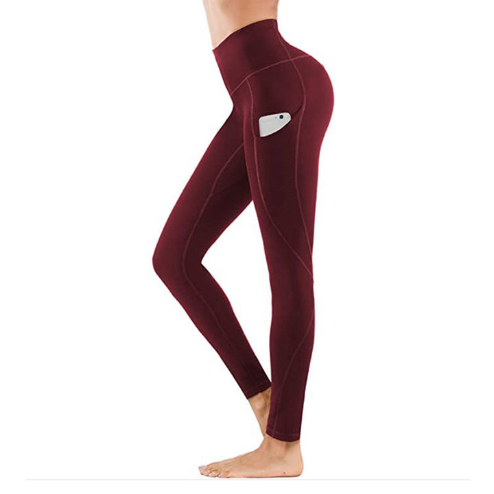 "Damhöga midjeleggings med fickor, rumplyft och kompression i svart, optimal för träning och stilfull vardagsanvändning."
