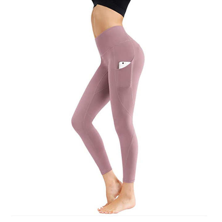 "Damhöga midjeleggings med fickor, rumplyft och kompression i svart, optimal för träning och stilfull vardagsanvändning."