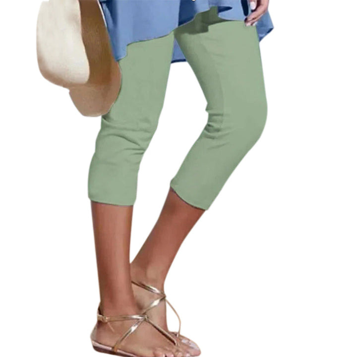 "Damhögmidja 3/4 yoga leggings med fickor, knälång, svart, smörmjuk yta, hög midja, främre fickor, stretchigt tyg."
