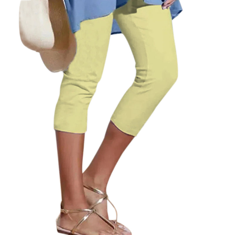 "Damhögmidja 3/4 yoga leggings med fickor, knälång, svart, smörmjuk yta, hög midja, främre fickor, stretchigt tyg."