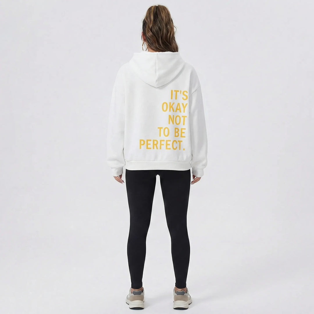 Trendig damhuvtröja för höst/vinter. Bekväm passform & unikt statementtryck på ryggen. Streetwear-stil.
