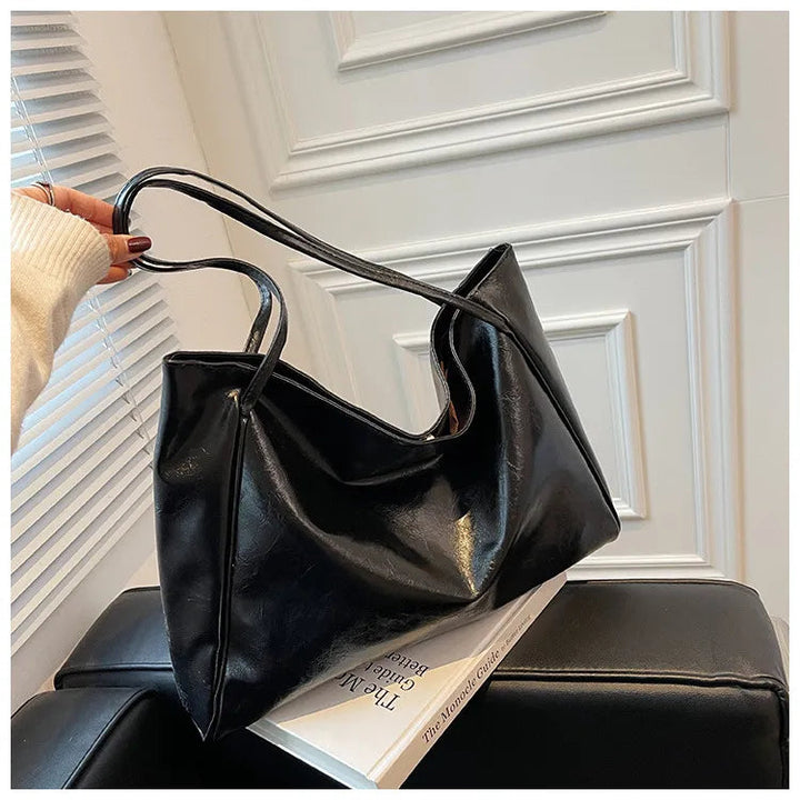Modern damsväska, bucketväska med justerbar rem, elegant och praktisk axelväska för alla stilar.