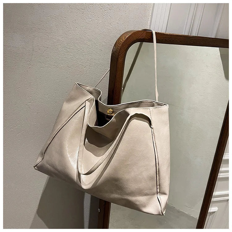 Stilren dams bucketväska, elegant handväska som axelväska, rymlig och modern accessoar.