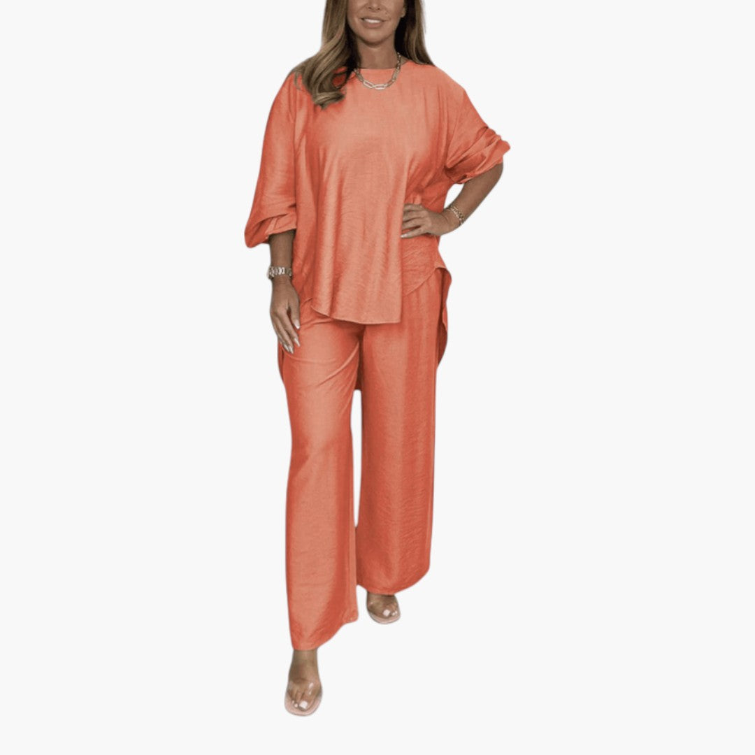 Trendigt damset för kvinnor. Matchande set med vida byxor och tröja för en snygg och bekväm look.