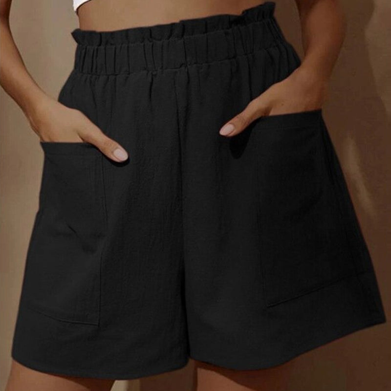 Damshorts med hög midja i bomull, framifrån. Perfekta för sommaren, med justerbar dragsko och två snedställda fickor.