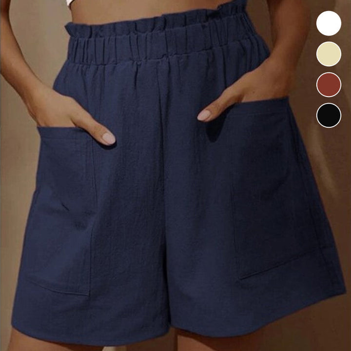 Damshorts med hög midja i bomull, framifrån. Perfekta för sommaren, med justerbar dragsko och två snedställda fickor.