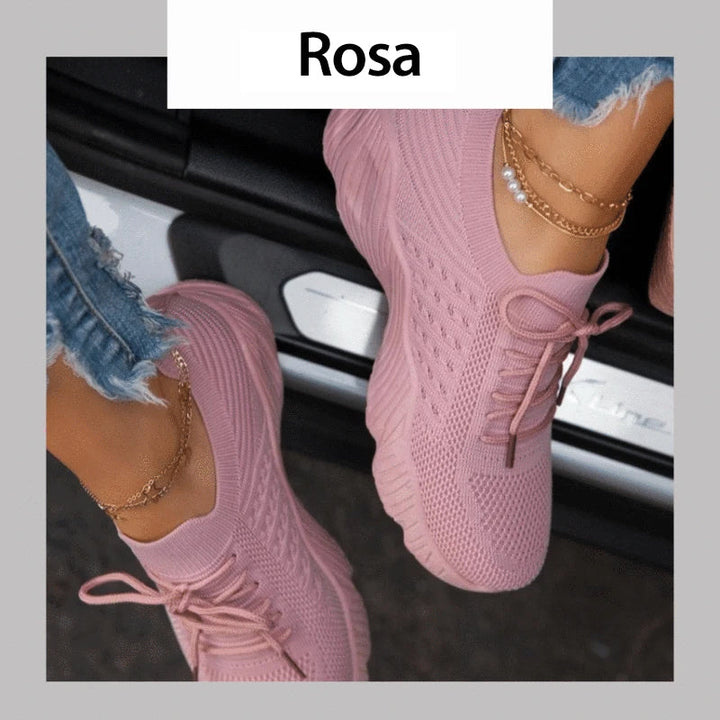 "Damskor casual sneakers, andningsbara och bekväma, i vit design med ergonomiskt stöd och halkfri sula."