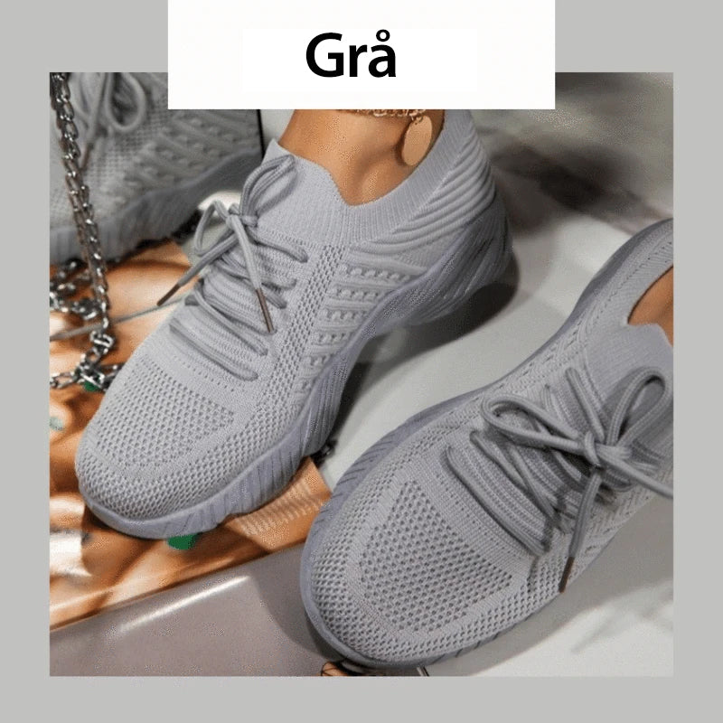 "Damskor casual sneakers, andningsbara och bekväma, i vit design med ergonomiskt stöd och halkfri sula."