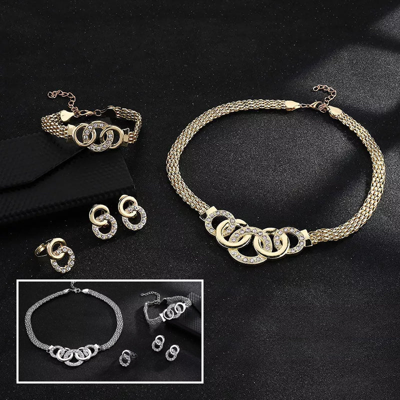 "Damsmyckesset i guld och silver med zirconia, innehåller halsband, armband, örhängen och ring, elegant design."