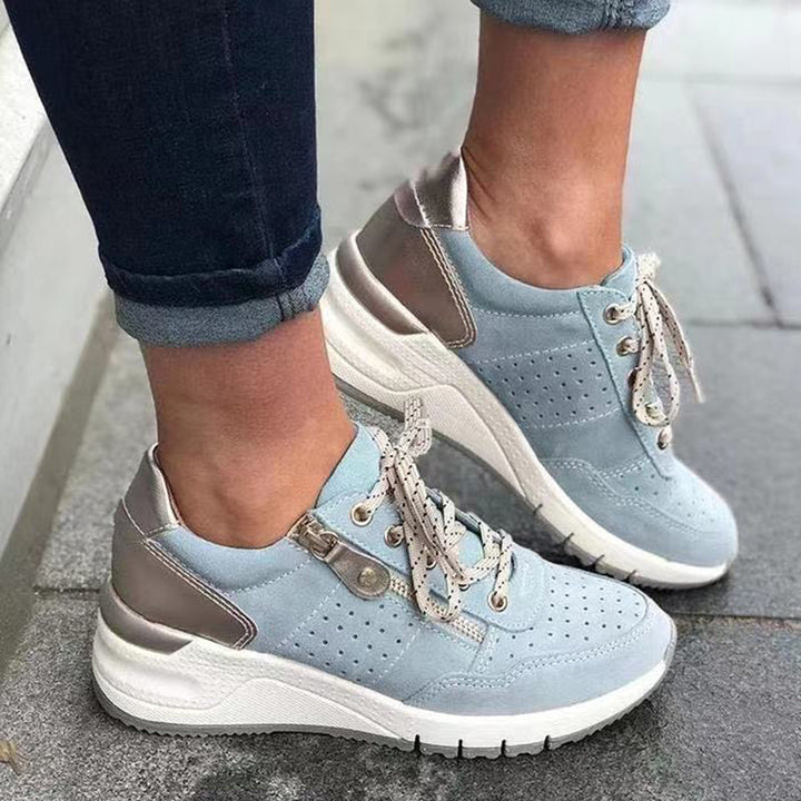 "Damsneakers med elastisk sula, andningsbar grön ovandel, stilren och bekväm design för moderna kvinnor."