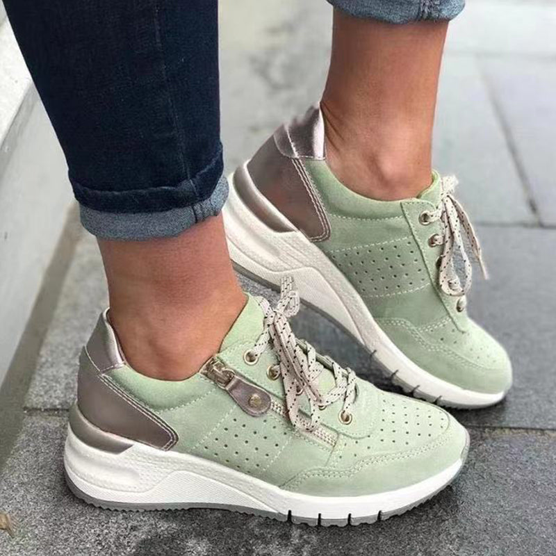"Damsneakers med elastisk sula, andningsbar grön ovandel, stilren och bekväm design för moderna kvinnor."