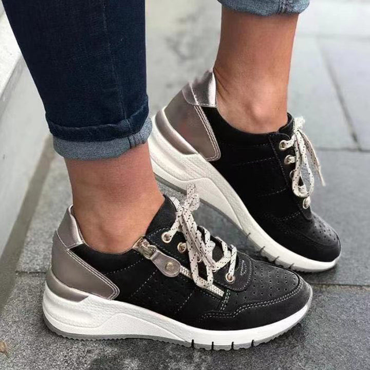 "Damsneakers med elastisk sula, andningsbar grön ovandel, stilren och bekväm design för moderna kvinnor."