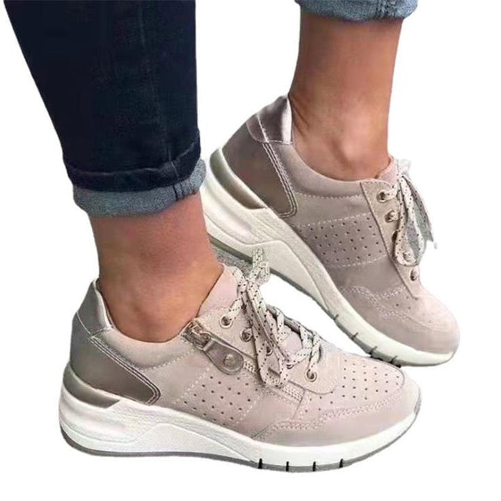 "Damsneakers med elastisk sula, andningsbar grön ovandel, stilren och bekväm design för moderna kvinnor."