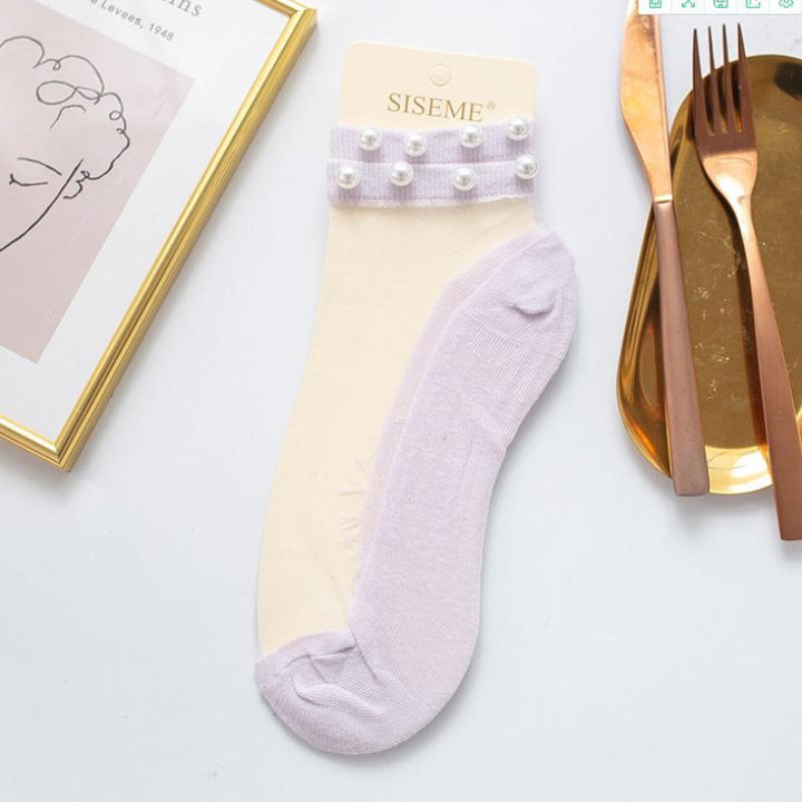 "Damsockor ankel i mjukt silke, andningsbara och lätta, i flera färger, eleganta och elastiska för optimal passform."