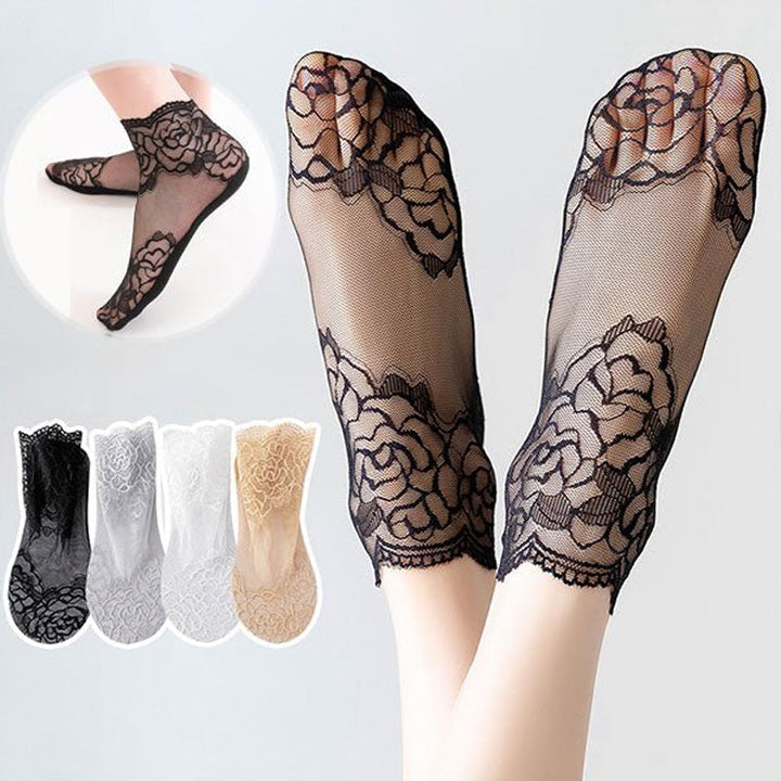 Damsockor i spetsnät, eleganta och andningsbara, med spetsbroderi i sofistikerad design, perfekt för både vardag och fest.