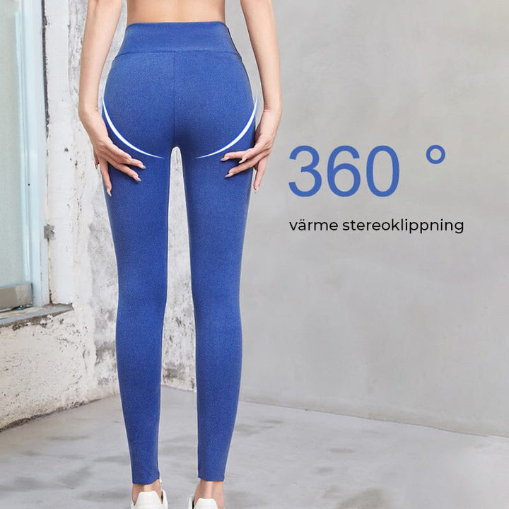 "Damspecifika självuppvärmande vinterleggings i svart, hög midja, ullfodrade för komfort och värme under kalla vintrar."