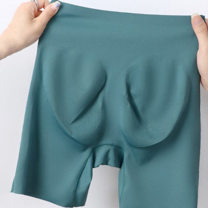 "Damspecifika sömlösa slipshorts i beige, eleganta och anti-skav med komfortabel passform och lätt kompression."