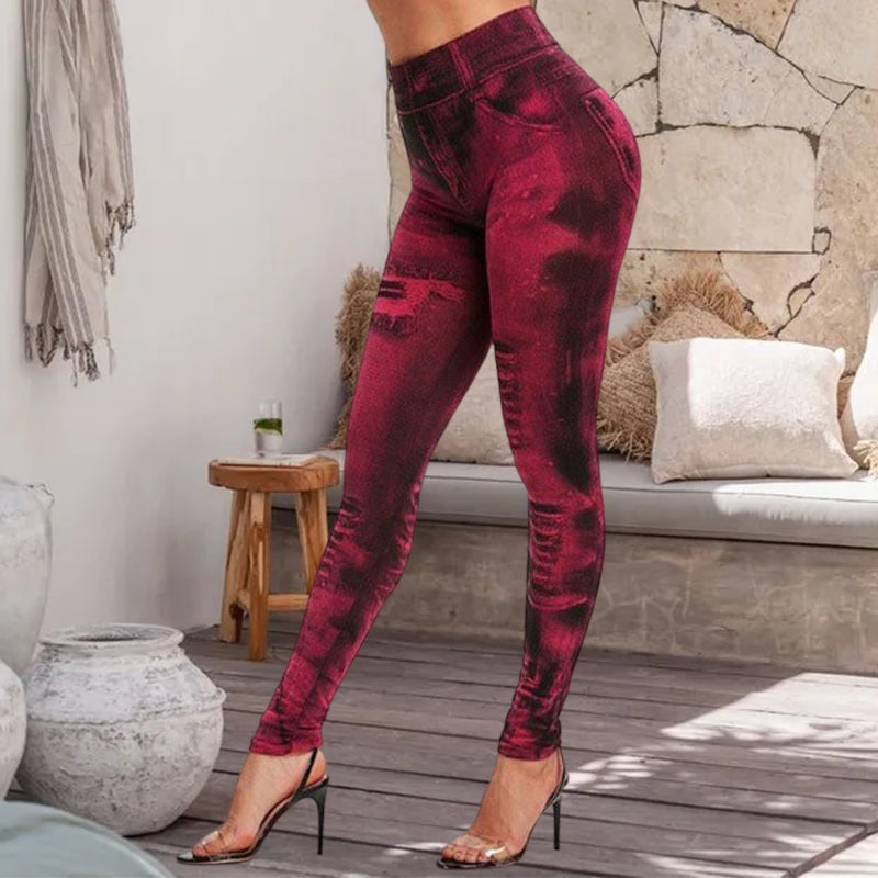 "Damsportleggings i denimlook med hög midja, pennbyxdesign, stilfullt blått tyg, fram- och sidovy."