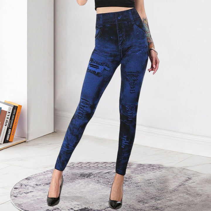 "Damsportleggings i denimlook med hög midja, pennbyxdesign, stilfullt blått tyg, fram- och sidovy."