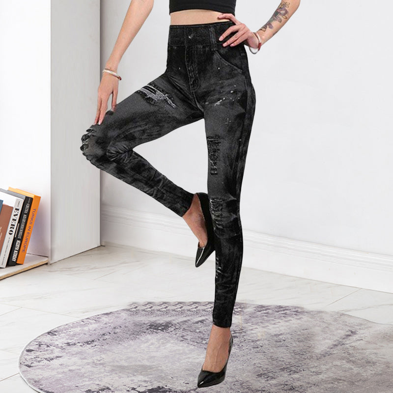 "Damsportleggings i denimlook med hög midja, pennbyxdesign, stilfullt blått tyg, fram- och sidovy."