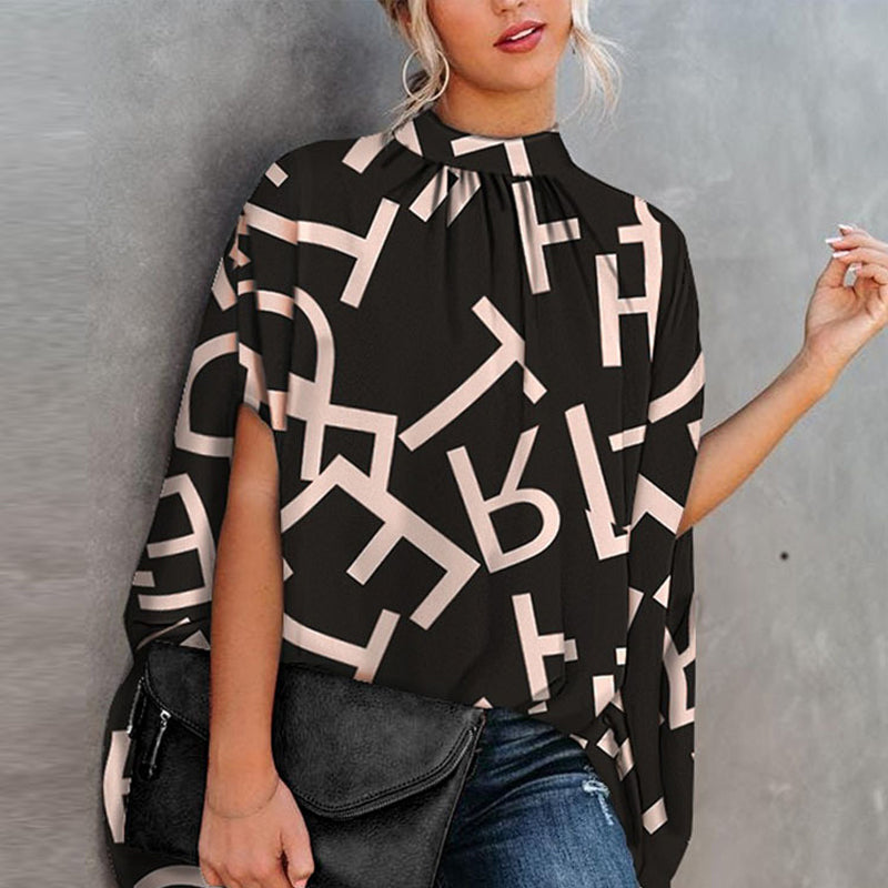 "Damtopp med livfullt tryck, färgglada mönster och dolman ärm för en stilfull och bekväm look, perfekt för alla tillfällen."