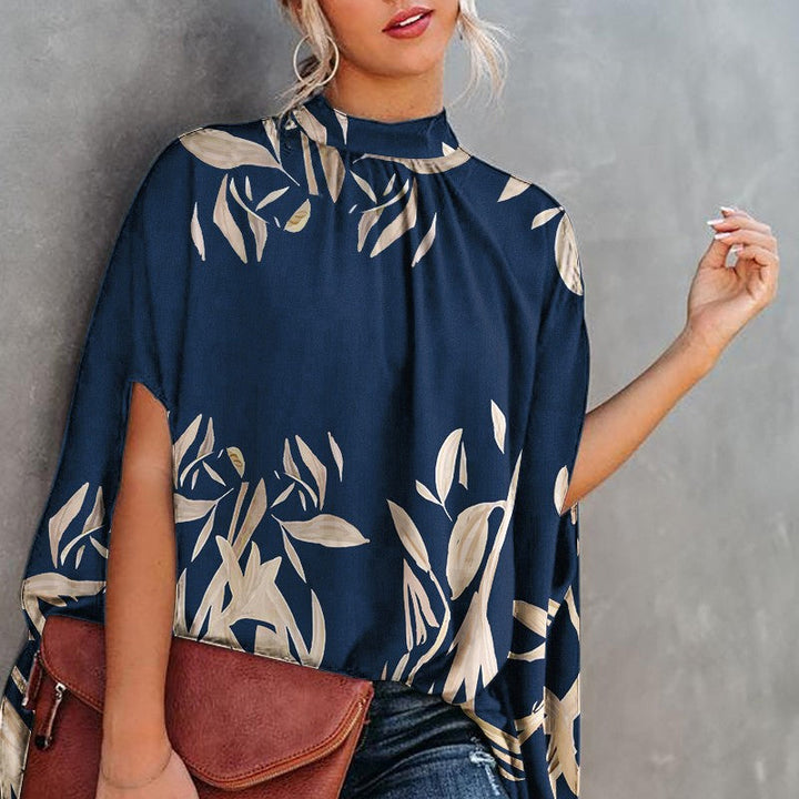 "Damtopp med livfullt tryck, färgglada mönster och dolman ärm för en stilfull och bekväm look, perfekt för alla tillfällen."