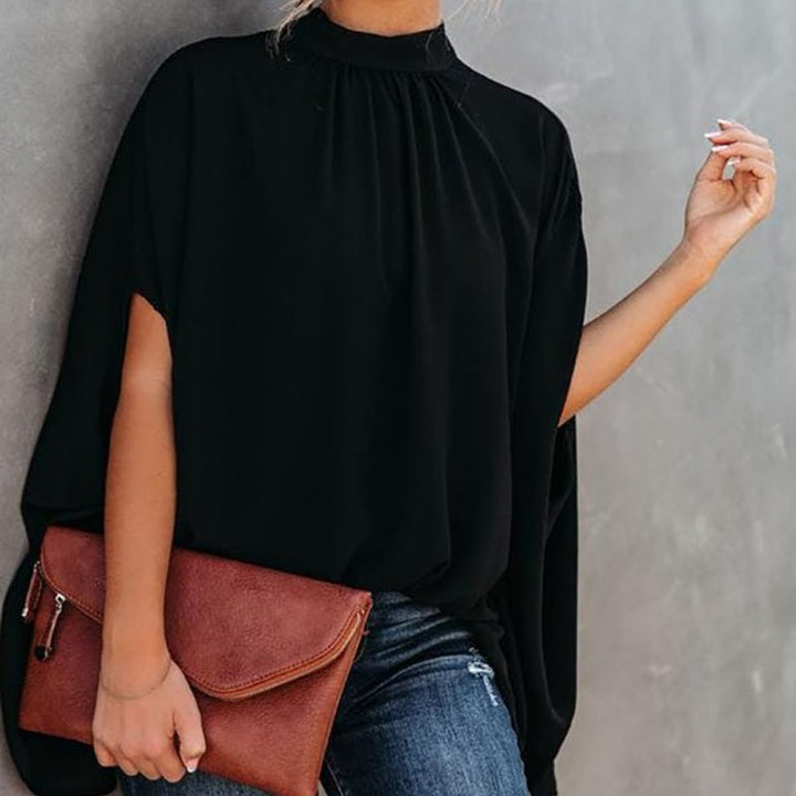 "Damtopp med livfullt tryck, färgglada mönster och dolman ärm för en stilfull och bekväm look, perfekt för alla tillfällen."