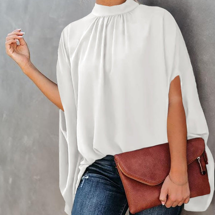 "Damtopp med livfullt tryck, färgglada mönster och dolman ärm för en stilfull och bekväm look, perfekt för alla tillfällen."